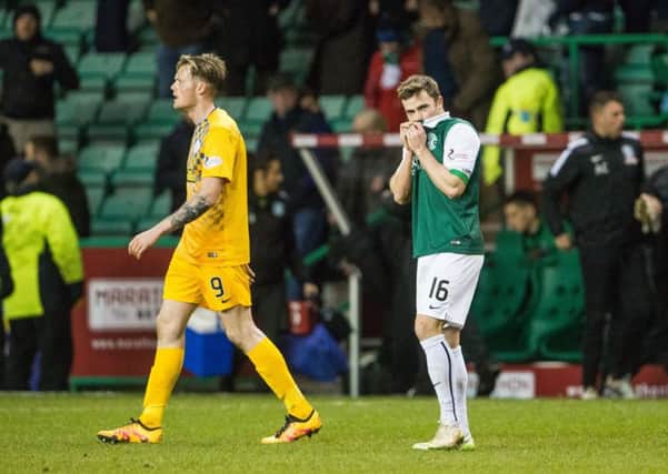 Lewis Stevenson, named captain on his 300th appearance for Hibs, cuts a dejected figure at full-time after Morton had stunned Easter Road by claiming a 3-0 win. Pic: Ian Georgeson