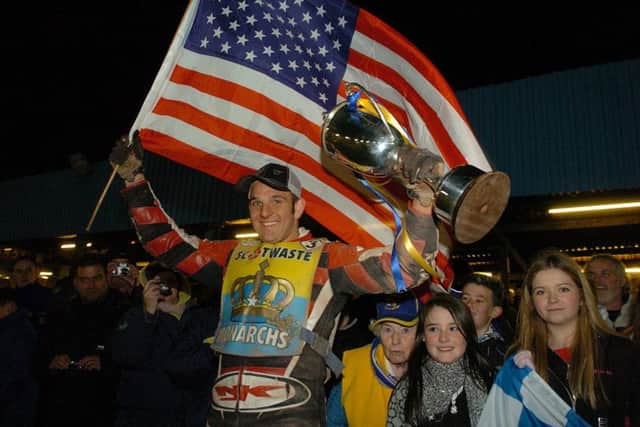 Ryan Fisher holds the Premier League trophy aloft in 2008 during his previous spell with the Monarchs. Picture: Bill Henry
