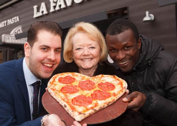 Hearts chairwoman Ann Budge is joined by striker Abiola Dauda and restauranteur Alberto Crolla to promote the clubs Italian-themed night for the match against Inverness. Picture:  Toby Williams