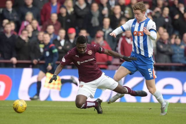 Kilmarnock's Stuart Findlay (right) fouls Hearts' Prince Buaben for a penalty. Picture: SNS