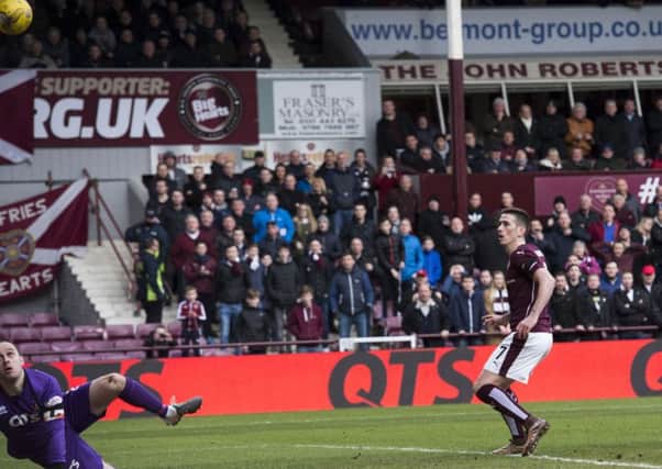 Hearts' Jamie Walker puts away the rebound after his unsuccesful penalty kick. Picture: SNS