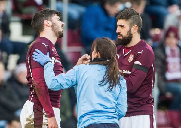 Callum Paterson feels the pain after injuring his shoulder. Pic: Ian Georgeson