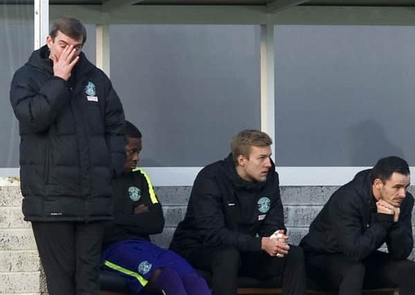 Alan Stubbs cuts a dejected figure on the Hibs bench during the defeat at Dumbarton
