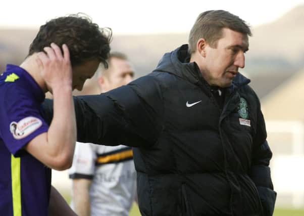 Hibs boss Alan Stubbs consoles Liam Henderson at the end of the game at Dumbarton