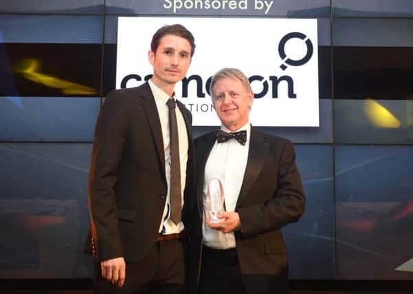 Gordon Drummond receives his lifetime achievement award from Adam Cameron. Picture: supplied