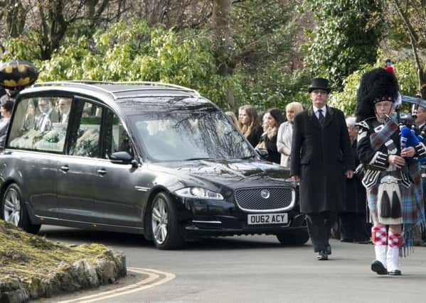 Uncle Alec pipes in the coffin at Leon Rendle's funeral at Warriston Crematorium, Edinburgh. Picture: Andrew O'Brien