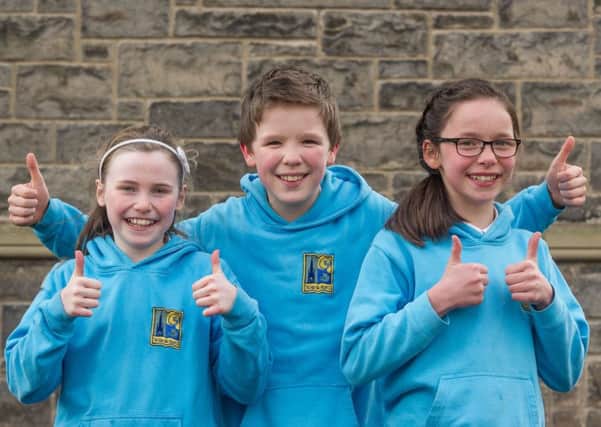 These pupils from Gaelic-speaking Taobh Na Pairce Primary School give the council's u-turn the thumbs-up. Picture: Steven Scott Taylor