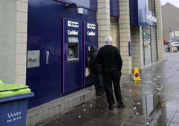 People are being warned to be aware before they put their cards into an ATM. File picture: Julie Bull