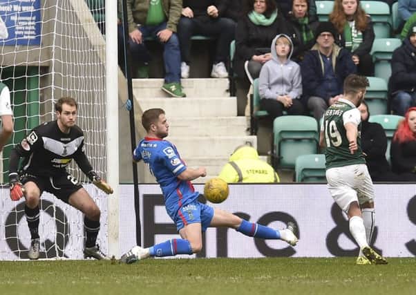 James Keatings strokes home the opening goal for Hibs