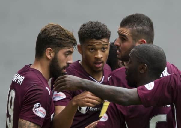 Osman Sow, centre, was a big hit at Hearts. Pic: SNS