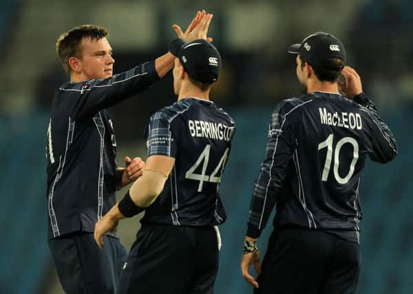 Heriot's spinner Mark Watt, left, took two wickets. Pic: Getty