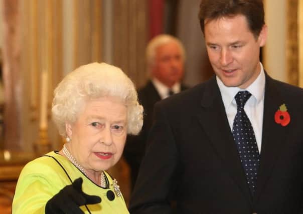 The Queen talks to Nick Clegg in 2011. Picture: Dominic Lipinski/PA Wire
