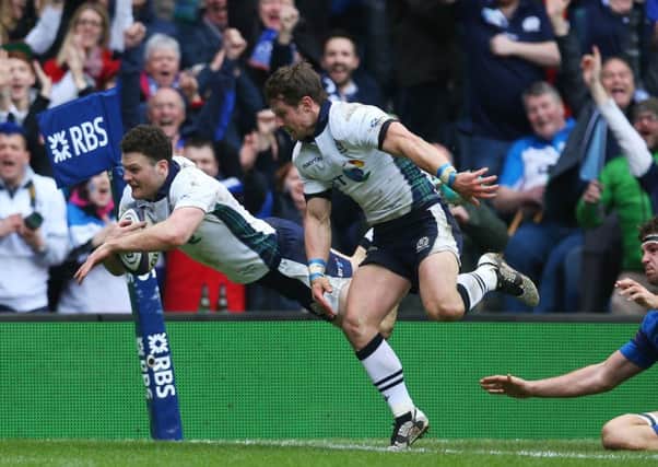 Duncan Taylor of Scotland dives over to score his team's second try. Picture: Getty
