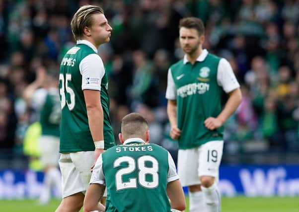 Dejected: Jason Cummings, Anthony Stokes and James Keatings at full time