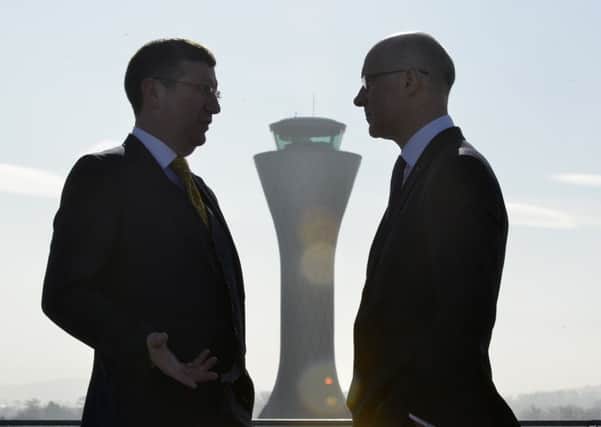 Deputy First Minister John Swinney in talks with airport chief executive Gordon Dewar. Picture: Julie Bull