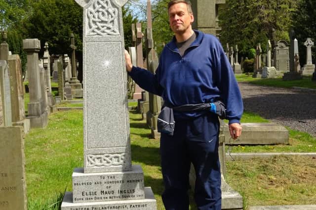 Gary Mill at
Elsie Inglis's grave in the Dean Cemetery. Picture: contributed