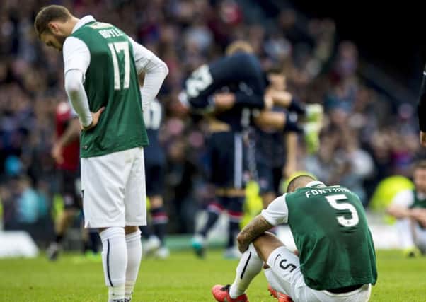 Dejection for Hibernian's Martin Boyle (left) and Liam Fontaine at full-time.