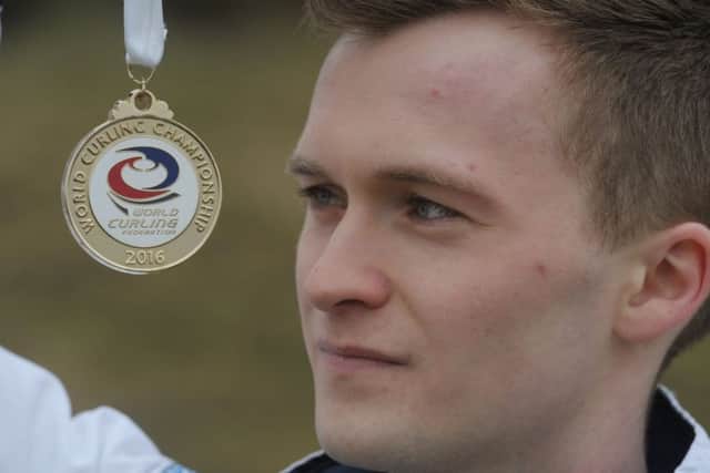 Brice Mouat showed off his medal on his return to Edinurgh. Picture: Steven Scott Taylor