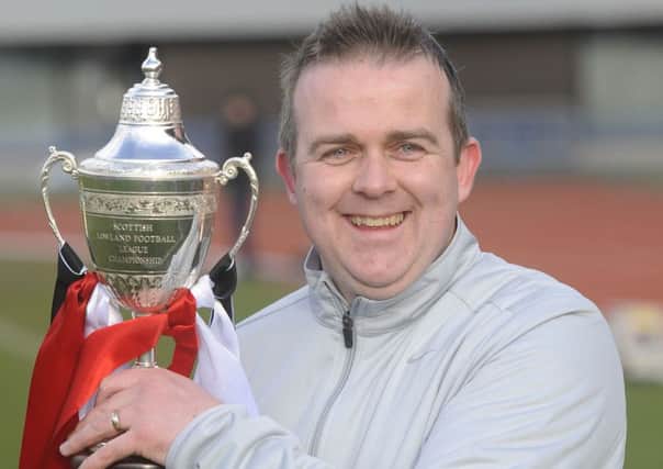 Gary Jardine with the Lowland League championship trophy