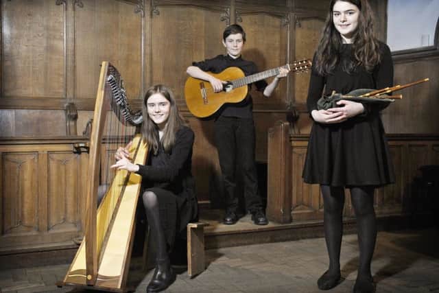 St Mary's Music School Brighde Chaimbeul (right) who has won through to the final of this year's BBC Radio 2 Young Folk Award, with her sister Kirsty aged 15 and brother Joseph aged 13. Picture: Neil Hanna