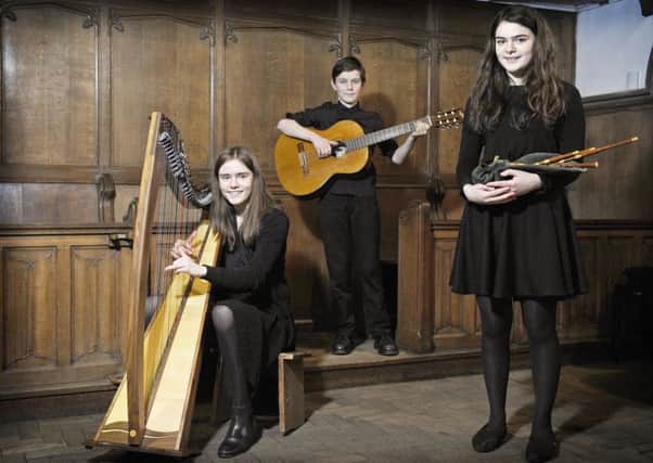 St Mary's Music School Brighde Chaimbeul (right) who has won through to the final of this year's BBC Radio 2 Young Folk Award, with her sister Kirsty aged 15 and brother Joseph aged 13. Picture: Neil Hanna