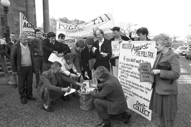 Leith MP Ron Brown (kneeleing, right) and other Labour party members (including Malcolm Chisholm, middle) stage an anti-Poll Tax demonstration at The Mound in Edinburgh, April 1988. Picture: Stanley Hunter