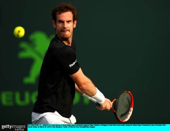 KEY BISCAYNE, FL - MARCH 28:  Andy Murray of Great Britain plays a backhand against Grigor Dimitrov of Bulgaria in their third round match during the Miami Open Presented by Itau at Crandon Park Tennis Center on March 28, 2016 in Key Biscayne, Florida.  (Photo by Clive Brunskill/Getty Images)