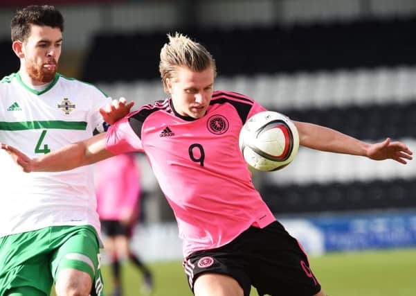 Hibs striker Jason Cummings missed a penalty and then twice scored for Scotland Under-21s. Pic: SNS