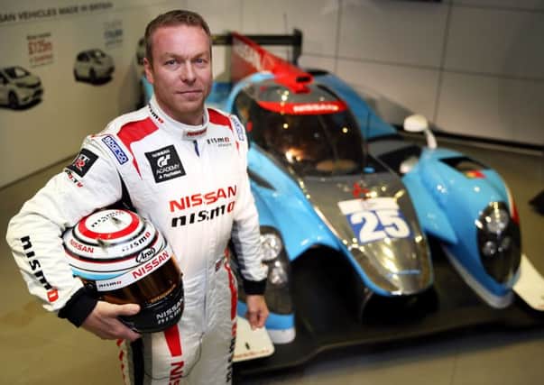 Chris Hoy in front of his Nissan LMP2