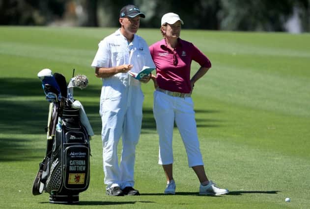 Catriona Matthew discusses a yardage with her caddie during the first round in California. Picture: Getty Images