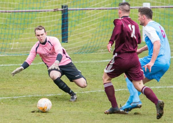 Whitehill Welfare goalkeeper Brian Young comes to collect a through ball. Pic: Ian Georgeson