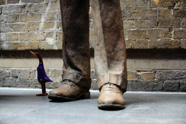 A wooden duck next to a statue of railway engineer Sir Nigel Gresley at King's Cross railway station, London. Picture: Clive Gee/PA Wire