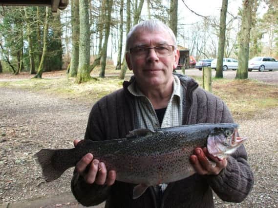 Andy Ross of Mayfield with 4lb rainbow at Orchill Loch on a Montana