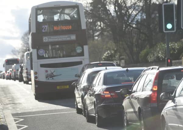 Traffic backed up to Ferry Road after an oil spill caused a bus crash. Picture: Greg Macvean