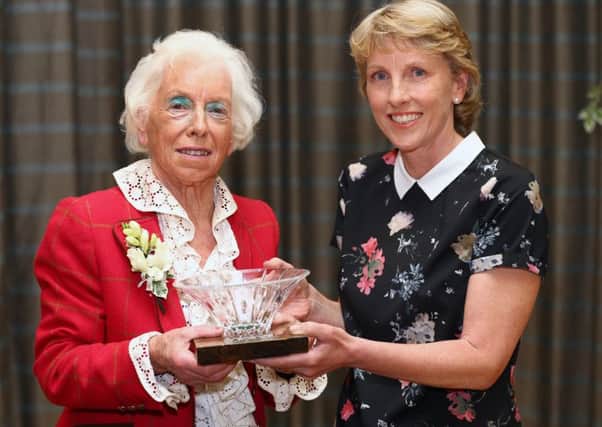 Janie Pryde receives her award from Julie Douglas. Picture: Gordon Fraser