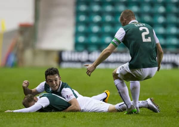 Martin Boyle, far left, is mobbed by John McGinn and David Gray after scoring his winning goal. Pic: SNS