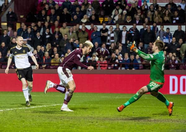 Juanma heads home Hearts' winner in the 2-1 triumph over Aberdeen. Pic: SNS