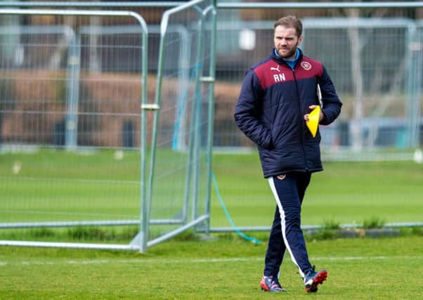 Hearts head coach Robbie Neilson is running the rule over Nikolai Todorov. Pic: SNS