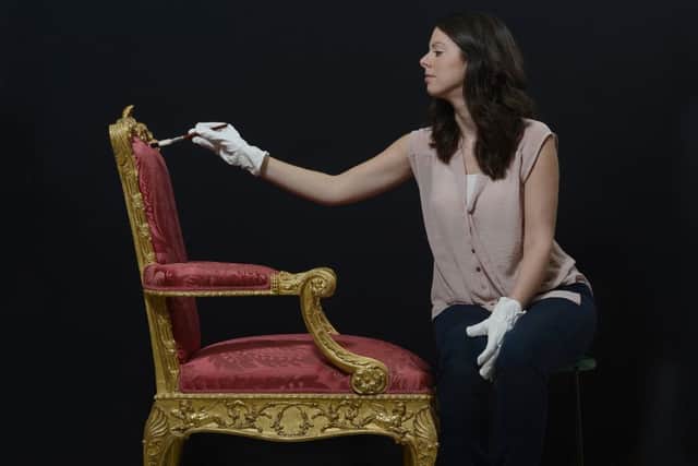 Assistant conservator Gemma Thorns works on a Chippendale chair made for Sir Lawrence Dundas in 1765. Picture: Neil Hanna