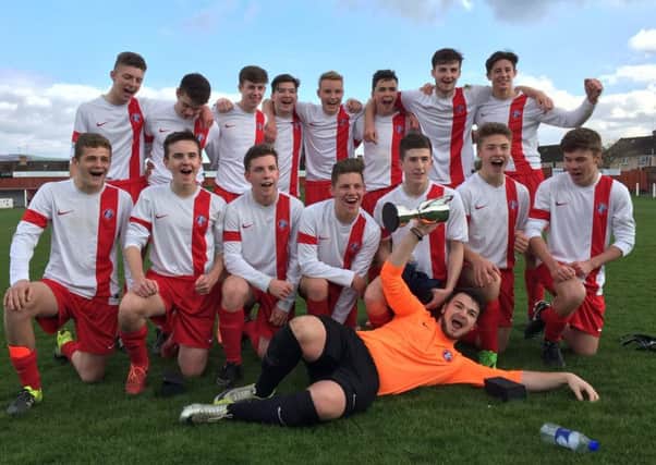 Spartans FC Reds 17s celebrate their success
