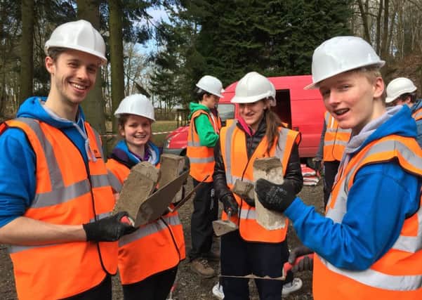Explorer Scouts learn some building skills before their trip. Picture: contributed