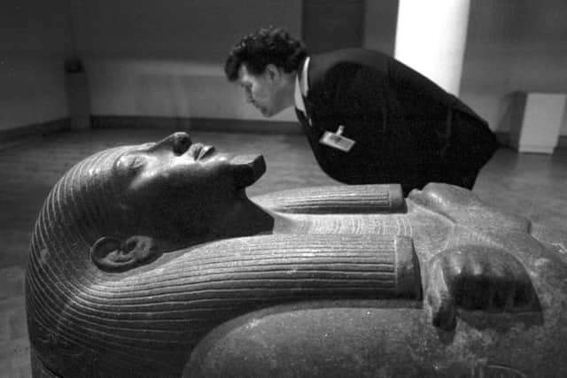 An unidentified security guard with a black basalt sarcophagus, part of the Gold of the Pharaohs exhibition of ancient Egyptian artifacts at the City Art Gallery in Edinburgh, January 1988. Picture: Alan Macdonald