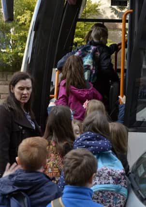 St Peters Primary pupils get on a bus to travel to alternative schools. Picture: Julie Bull