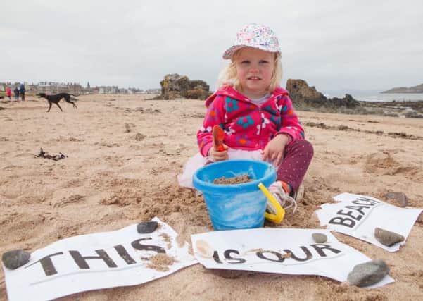 Lilah Revell joins the protest on North Berwick beach. Picture: Toby Williams