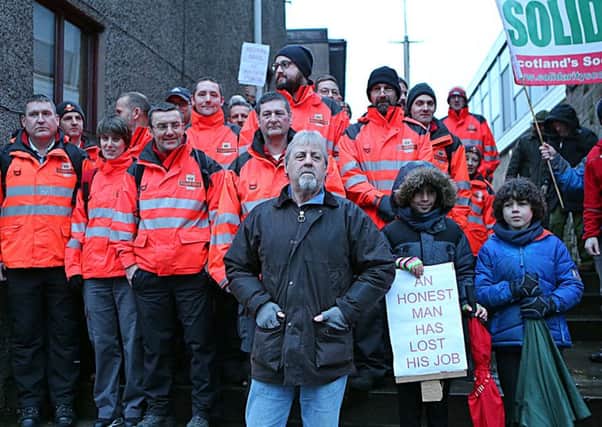 Dave Mitchell with postal workers in Cupar, Fife, protesting against his dismissal. Picture: Dave Scott