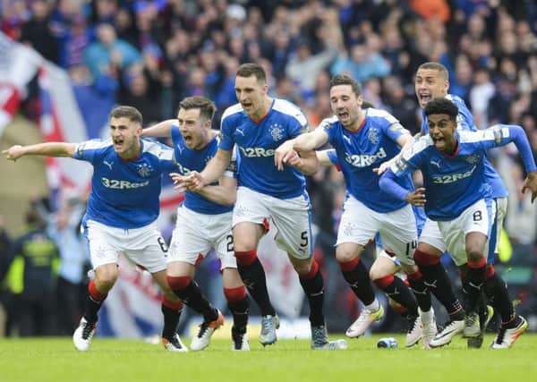 The Rangers players celebrate their penalty shoot-out win