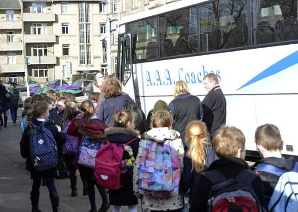 Pupils from St Peter's RC Primary School being bused to other schools. Picture: Julie Bull