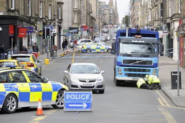 Police take a look at a bin lorry involved in a fatal accident at Morningside. Picture: Neil Hanna