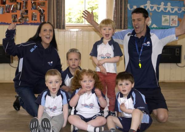 Laura and Graham Muir with a few of the Rugby tots.