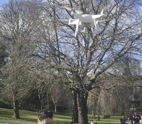 The man using the drone in Princes Street Gardens.